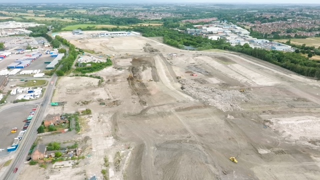 A drone shot of the site currently being redeveloped showing a huge expanse of earthworks in preparation for building new factories on.
